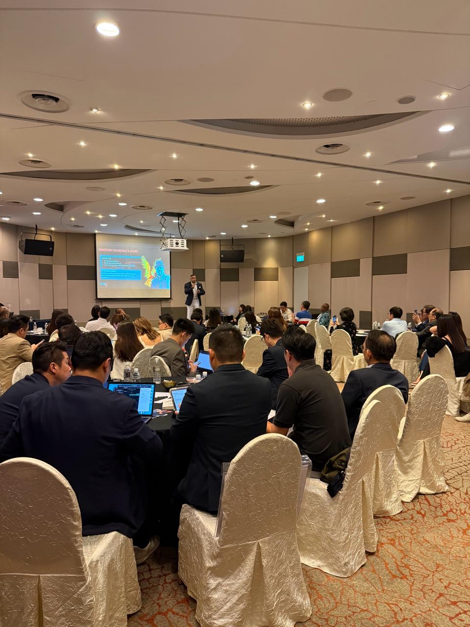 Magesh Das delivering a keynote presentation